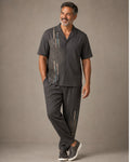 Big and tall man wearing the Stone Ripple Ledger pocket-free shirt and matching pants set, clean full-body studio view