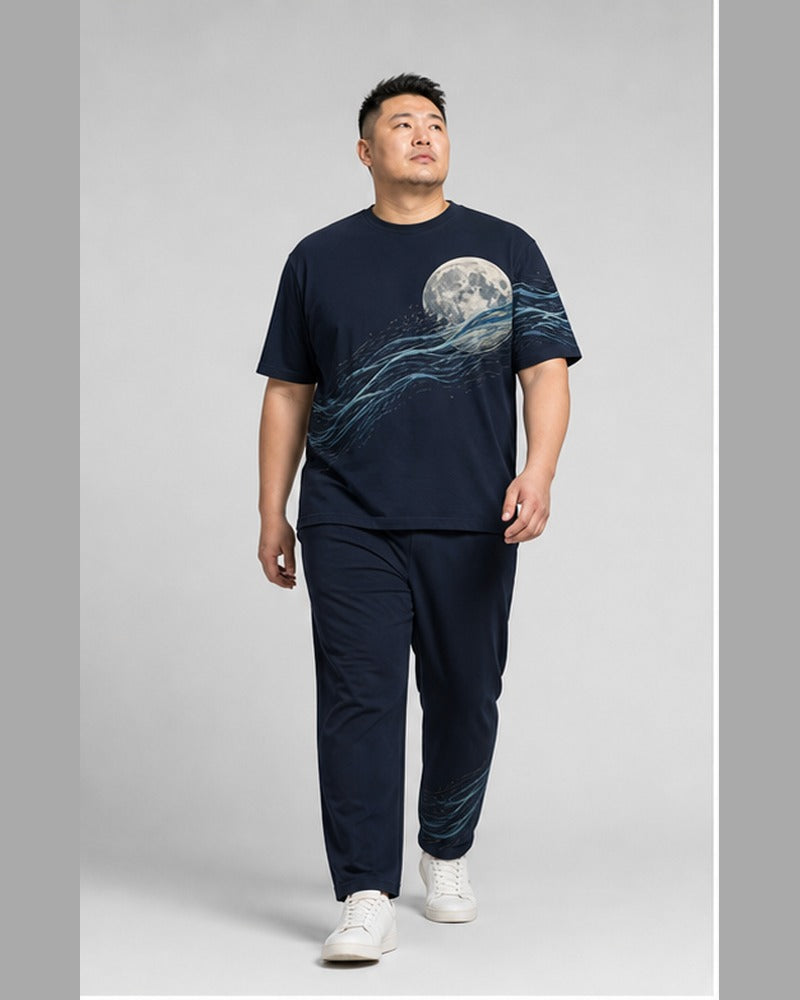 Big and tall man wearing the Tidal Moon Current t-shirt and matching pants set, clean full-body studio view
