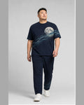 Big and tall man wearing the Tidal Moon Current t-shirt and matching pants set, clean full-body studio view