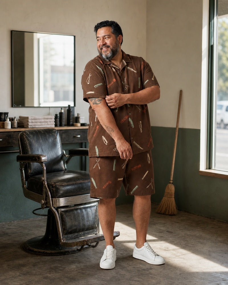 Big and tall man styling the Tobacco Mint Barber Kit pocket-free shirt and matching shorts set in a natural lifestyle scene