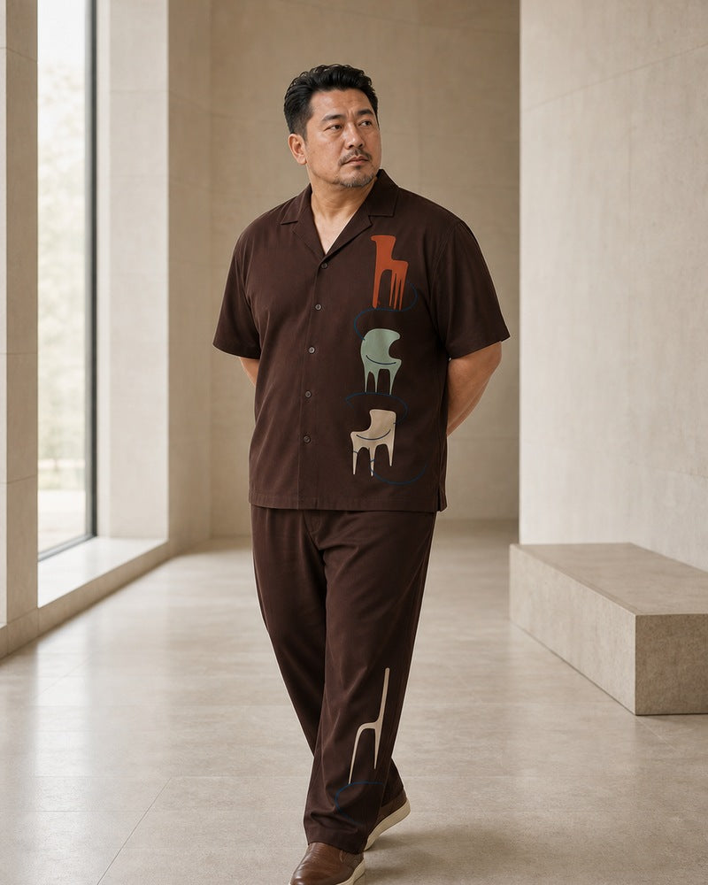 Big and tall man styling the Umber Chair Museum pocket-free shirt and matching pants set in a natural lifestyle scene