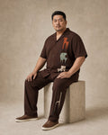 Big and tall man wearing the Umber Chair Museum pocket-free shirt and matching pants set, full-body product view